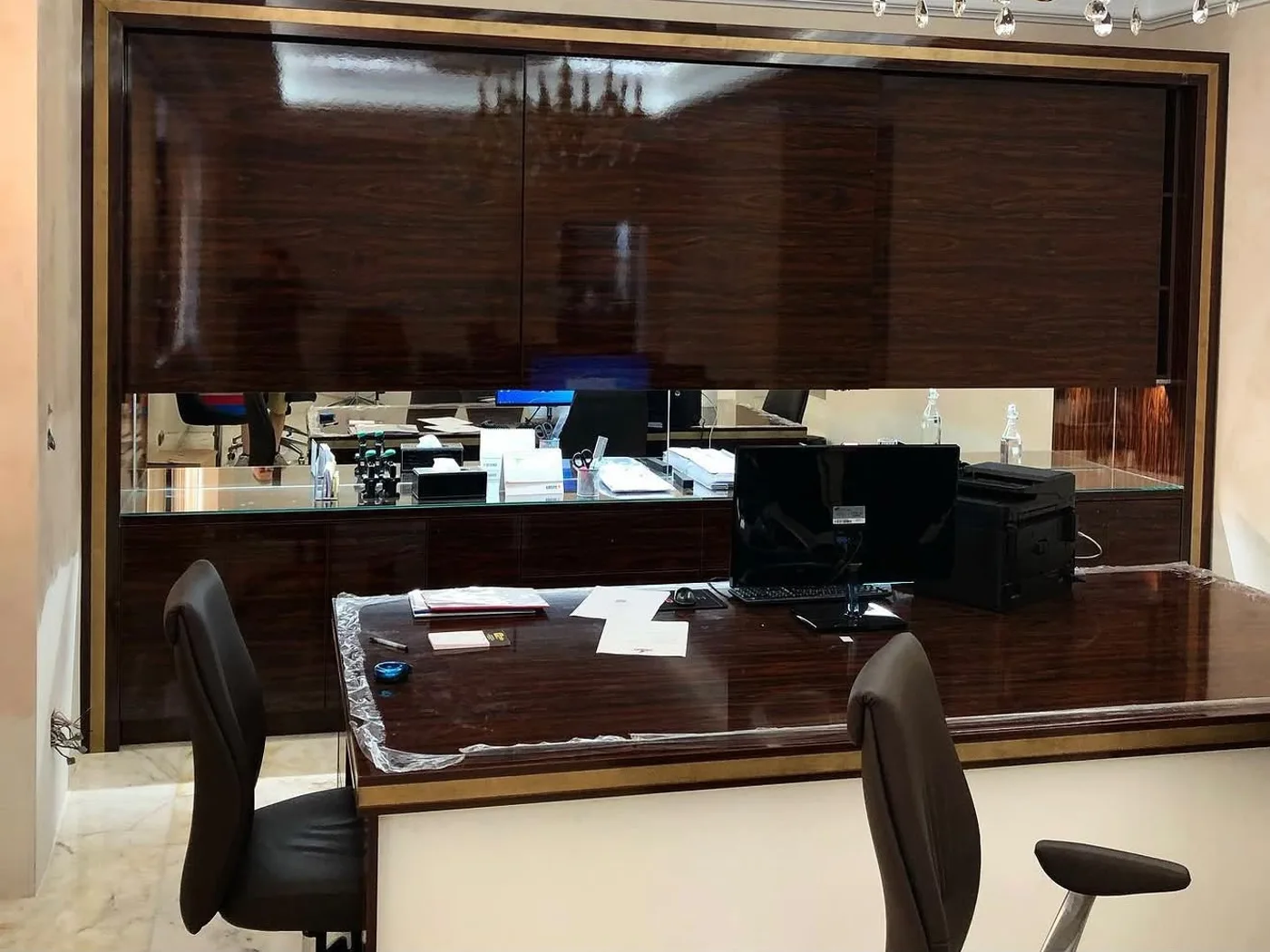 Desk with wall unit and ceiling light