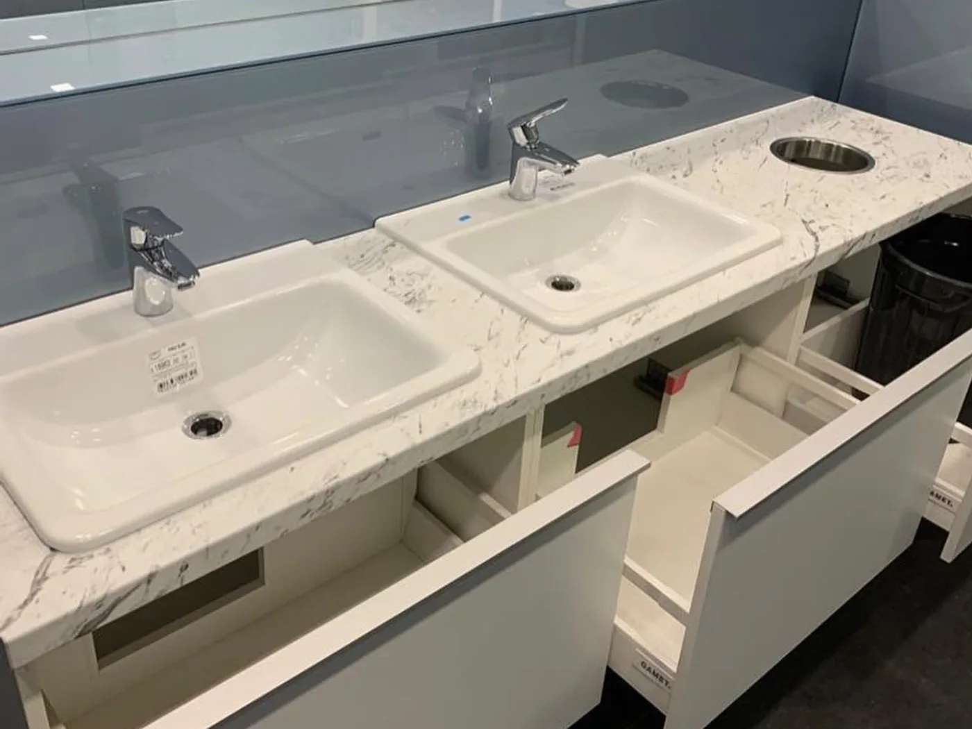 Opened drawers beneath the vanity unit